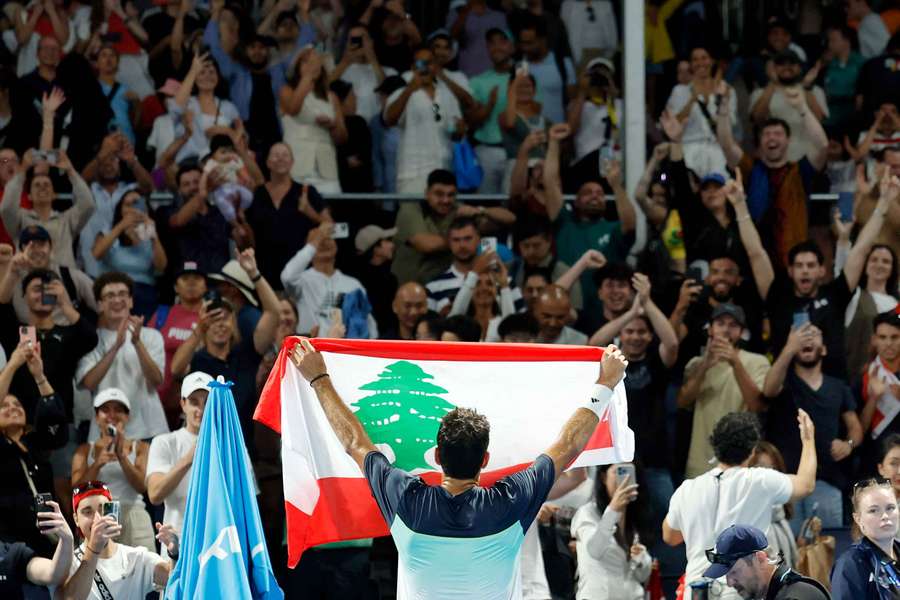 Habib celebrates with a Lebanon flag