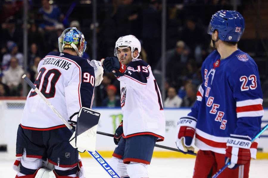 Blue Jackets' Elvis Merzlikins #90 and Dante Fabbro #15 celebrate win over Rangers