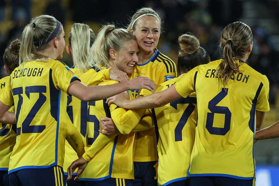 Sweden's forward #15 Rebecca Blomkvist (C-L) celebrates after scoring her team's fifth goal 