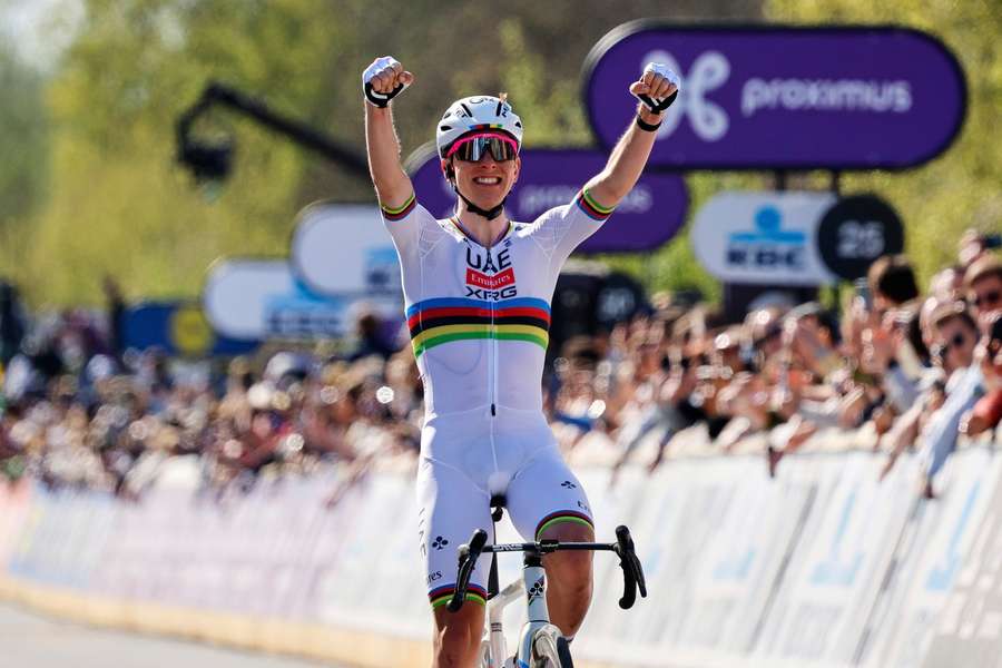 Outstanding Pogacar celebrates as he crosses the finishing line