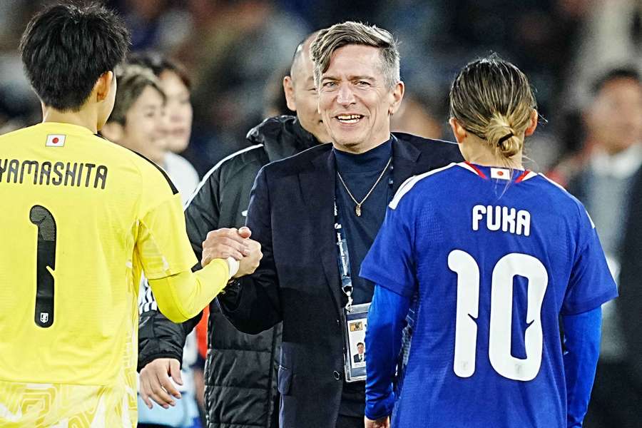 Japan women's head coach Nils Nielsen celebrates their November home win over Canada. 