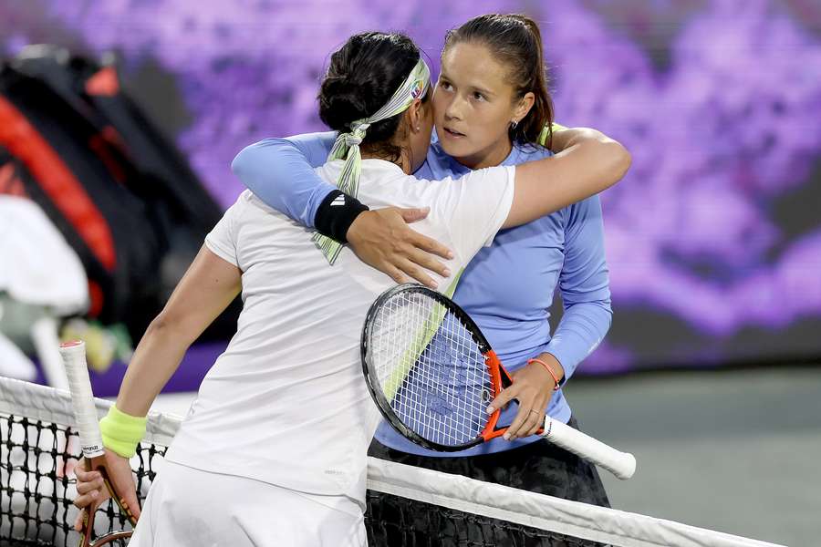 Ons Jabeur of Tunisia meets Daria Kasatkina of Russia at the net after their match