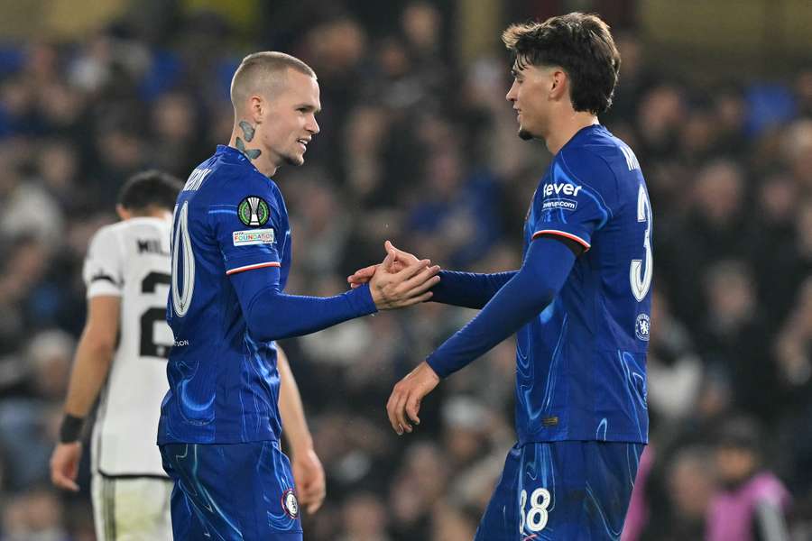 Mykhailo Mudryk (left) celebrates with Marc Guiu after scoring for Chelsea