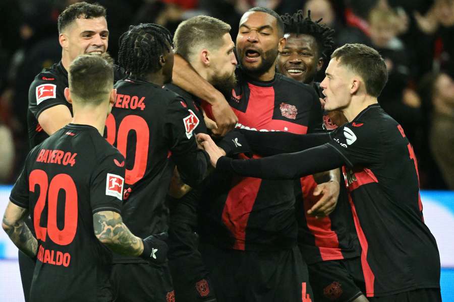 Bayer Leverkusen's Robert Andrich (C) celebrates after scoring with his teammates