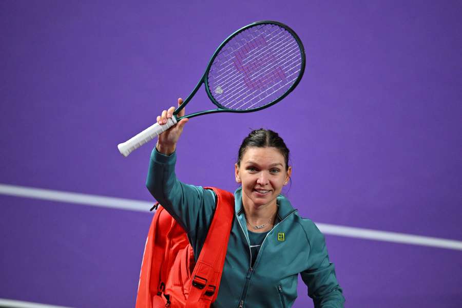 Simona Halep waves to the crowd after her final match