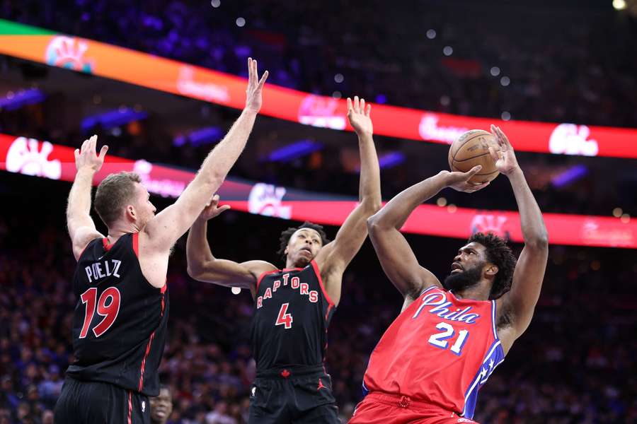 Embiid (R) in action for the 76ers