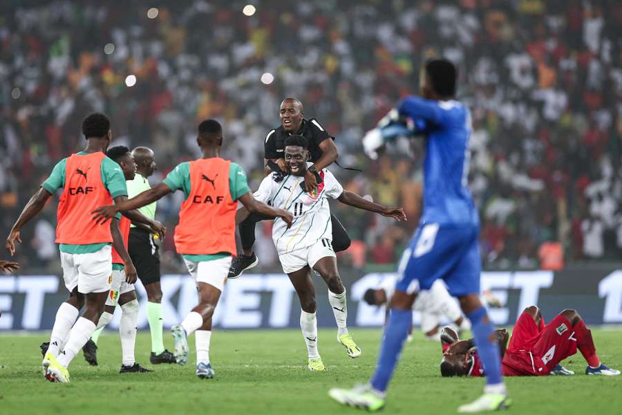 Guinea celebrate reaching the quarters