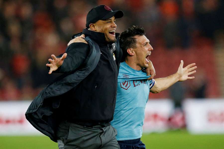 Vincent Kompany celebrates Jack Cork after getting Burnley promoted from the Premier League