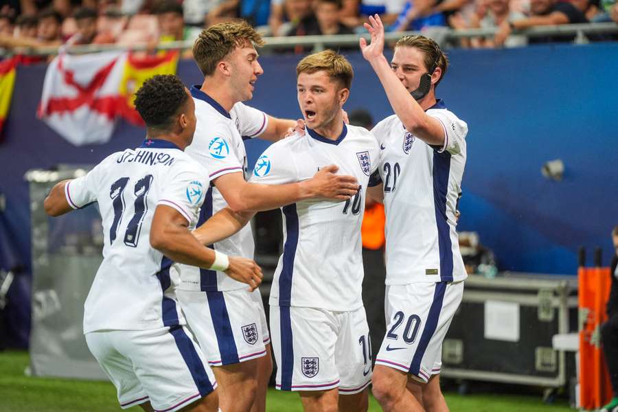 England's players celebrate with James McAtee after his opening goal