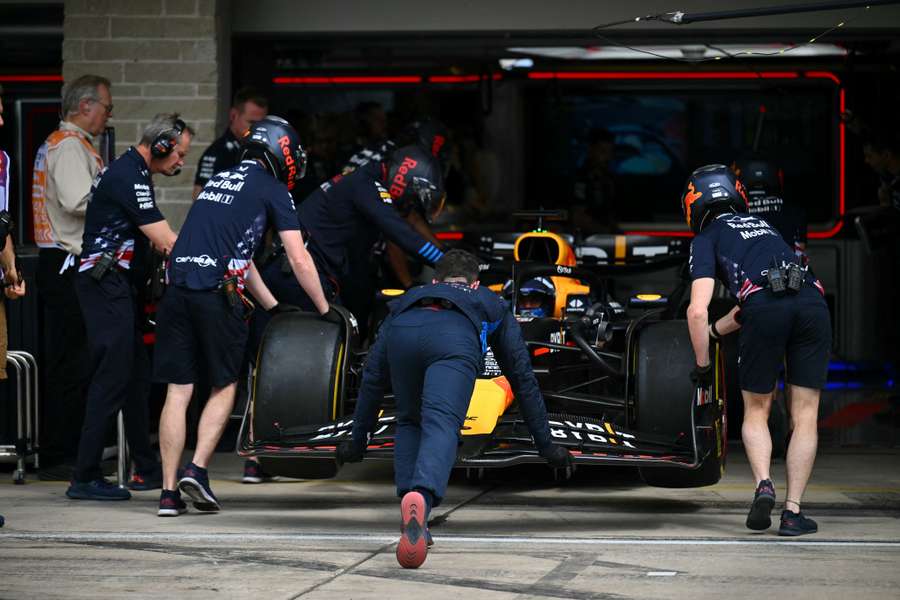 Max Verstappen's car is pushed into the garage during the practice session for the United States Grand Prix