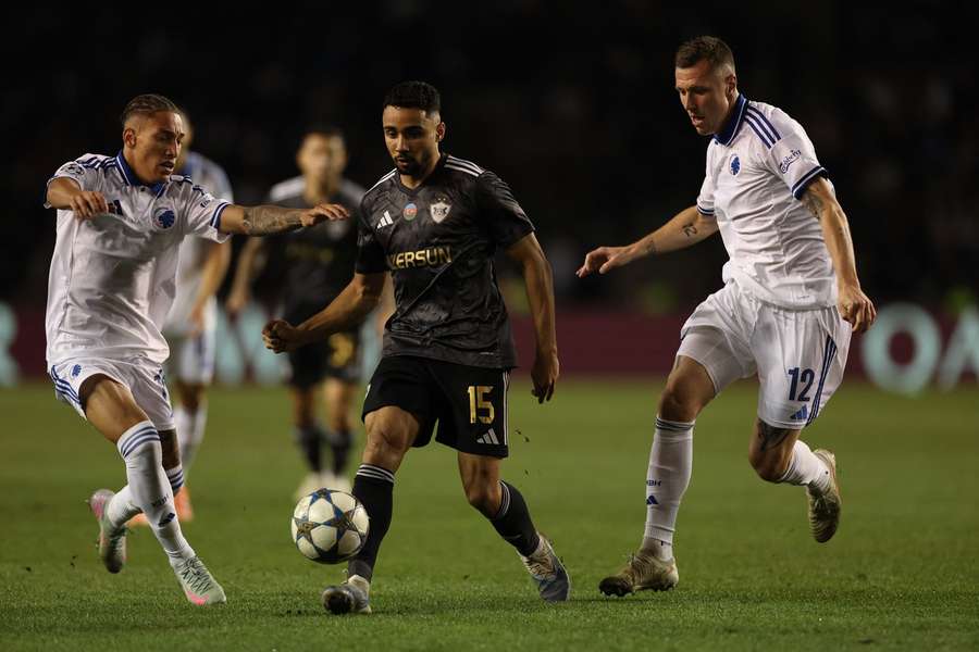 FC Copenhagen's French defender Yoram Zague, Qarabagh's Leandro Andrade and FC Copenhagen's  Lukas Lerager in action
