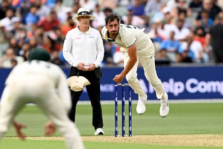 Australian bowler Mitchell Starc sends down a delivery on the first day of the second Test between Australia and India at the Adelaide Oval 