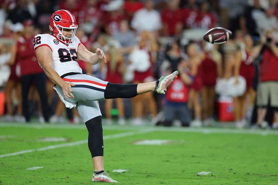 Georgia's Brett Thorson punts the ball in a game against Alabama (2024) Georgia's Brett Thorson punts the ball in a game against Alabama (2024)