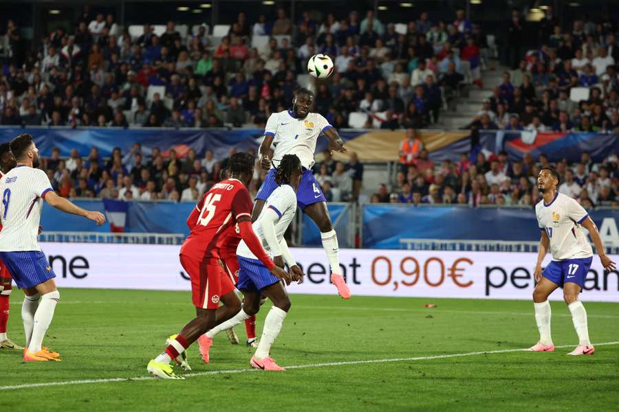 France defender Dayot Upamecano heads the ball towards goal