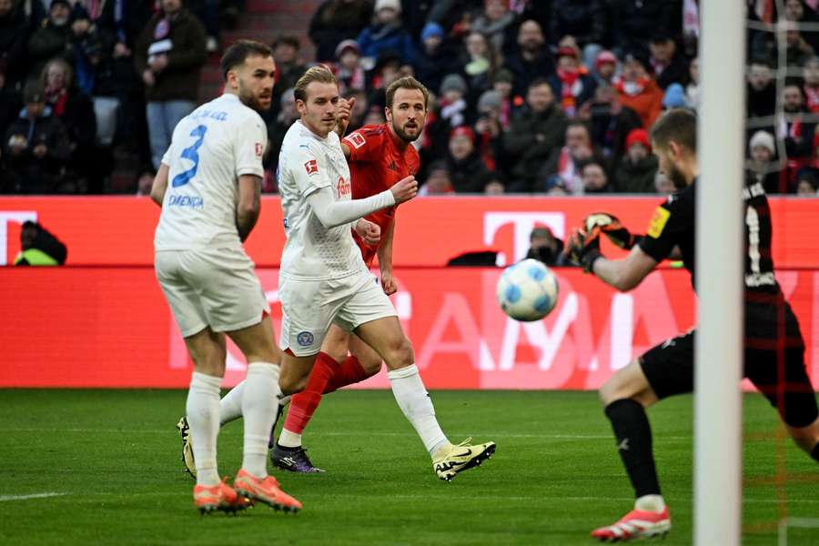 Bayern Munich's English forward #09 Harry Kane (2R) scores his team's third goal