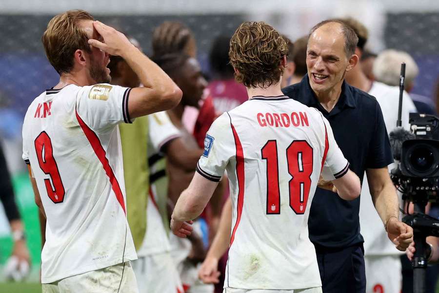 Thomas Tuchel, Anthony Gordon and Harry Kane celebrate after England qualified for the last 16 stage of the World Cup