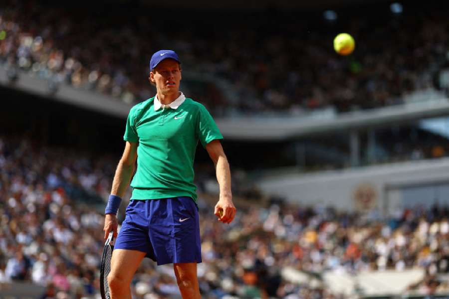 Sinner in action against Djokovic