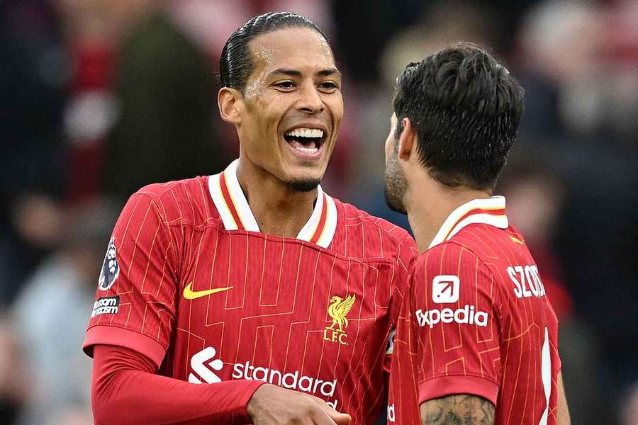 Dominik Szoboszlai of Liverpool interacts with Virgil van Dijk