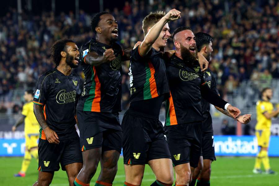 Hans Nicolussi Caviglia (centre) of Venezia celebrates with teammates after scoring their second goal