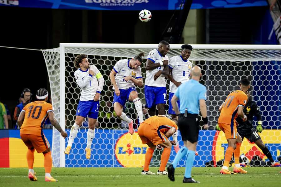 Memphis Depay (left) taking a free kick for the Netherlands against France at EURO 2024