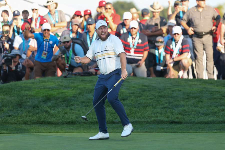 Lowry celebrates as Europe retain Ryder Cup after US fightback