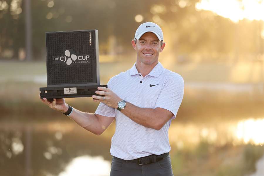 Rory McIlroy celebrates with the trophy after winning during the final round of the CJ Cup at Congaree Golf Club