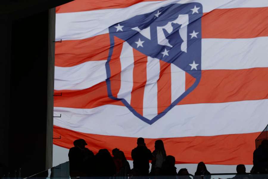 Atletico Madrid fans display a flag in the stands