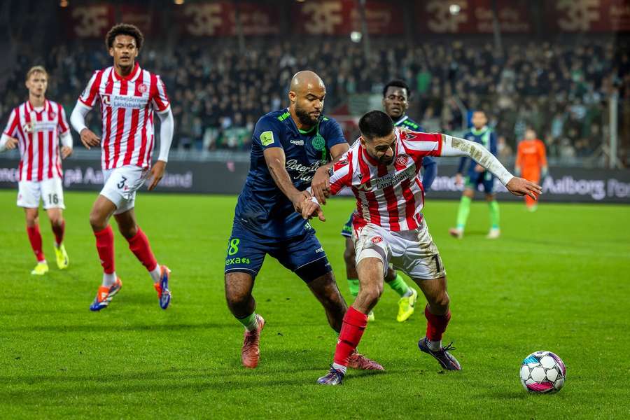 AaB's Andres Jasson and Viborg's Jean Manuel Mbom tussle for the ball in Friday's encounter