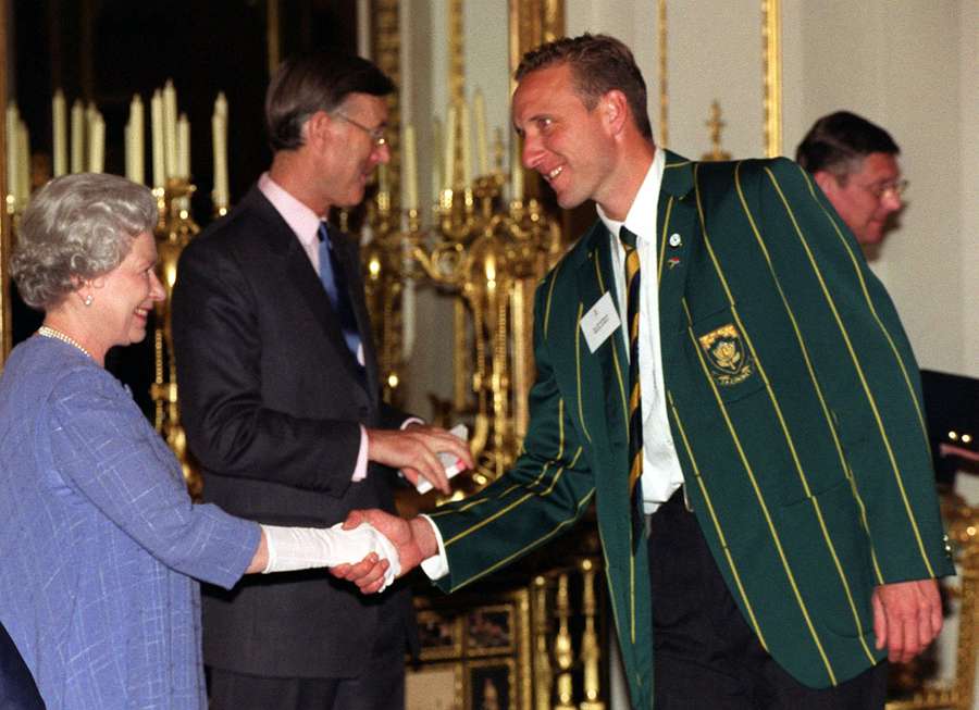 Queen Elizabeth II shakes hands with South African cricketer Allan Donald during a World Cup reception at Buckingham Palace. England primarily hosted the 1999 event