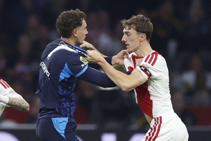 PSV's Ruben van Bommel and Ajax's Youri Baas are involved in a scuffle after a reckless challenge from Van Bommel