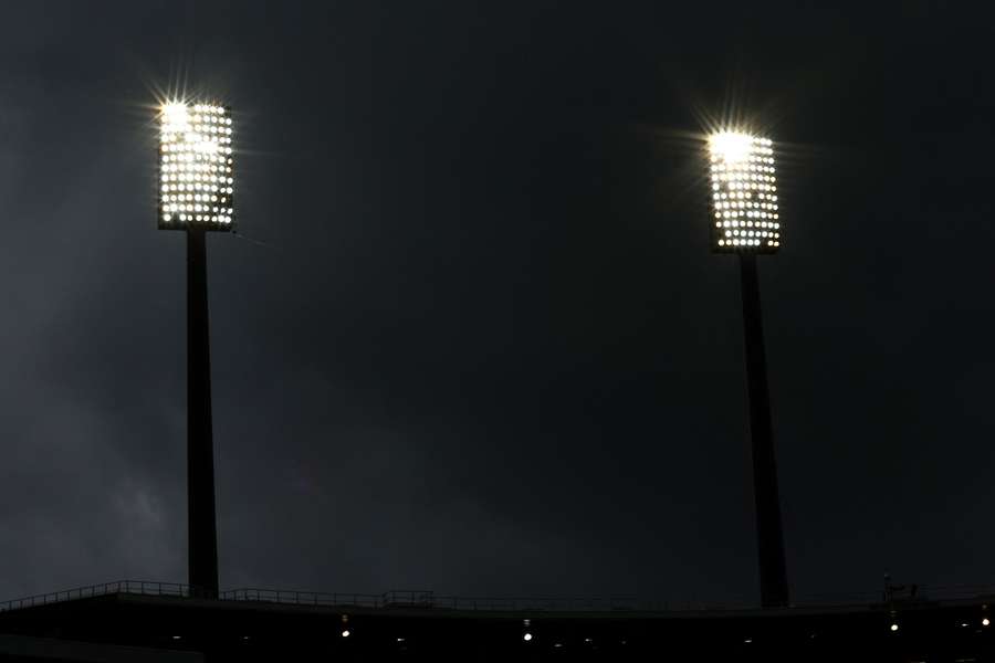 A general shot of a dark Sydney Cricket Ground during Sunday's bad light delay.