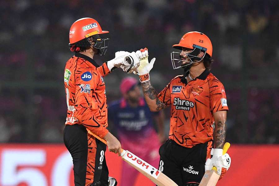Sunrisers Hyderabad's Abhishek Sharma celebrates after reaching his half-century with Ishan Kishan
