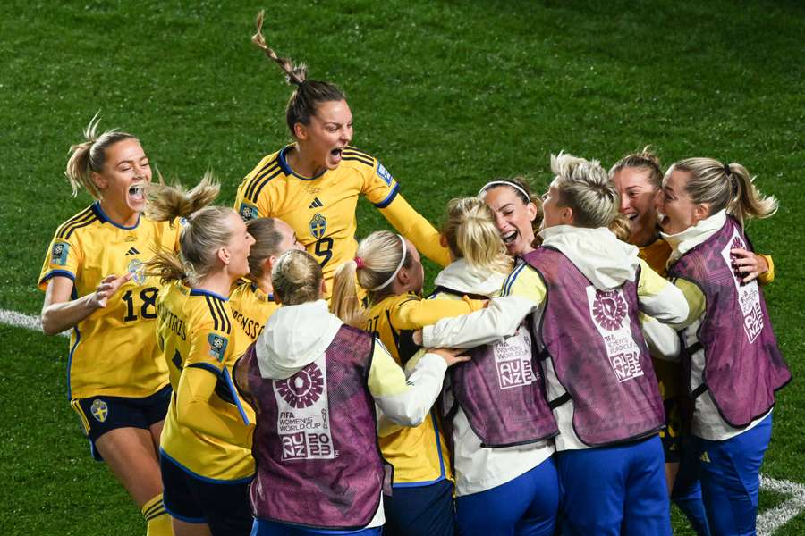 Sweden's players celebrate after scoring against Japan