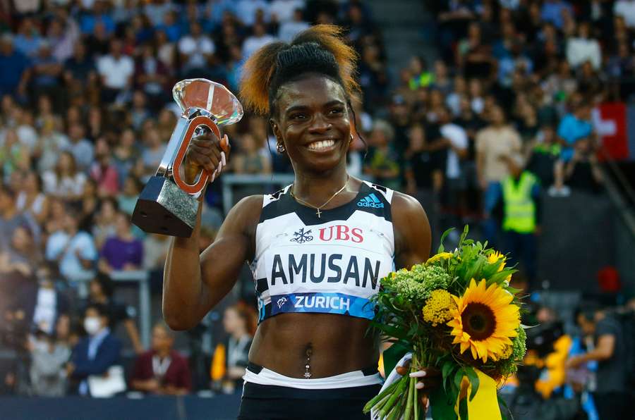 Amusan celebrates after winning the women's 100m hurdles