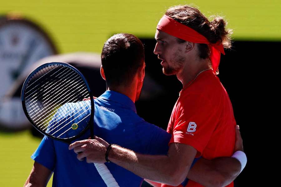 Novak Djokovic hugs Alexander Zverev after retiring from their semi-final match 
