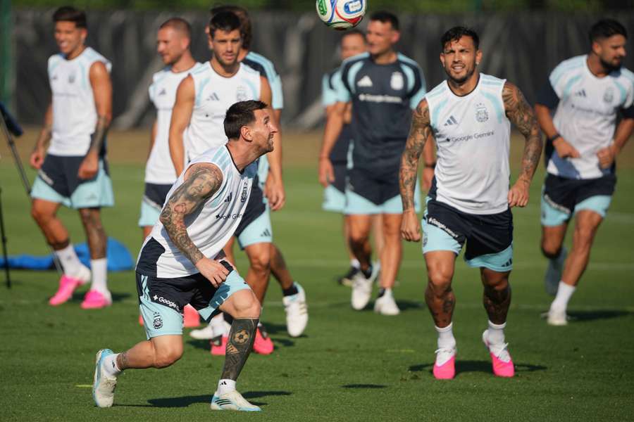 Argentina's Lionel Messi, Leandro Paredes, and teammates during training