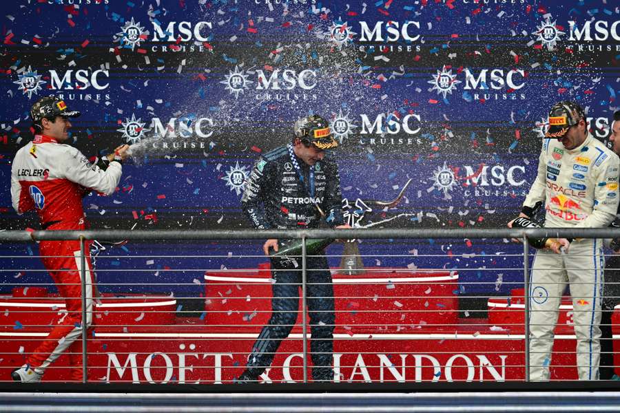 Kimi Antonelli on the podium with Charles Leclerc and Max Verstappen