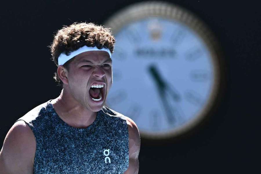 Ben Shelton celebrates his win