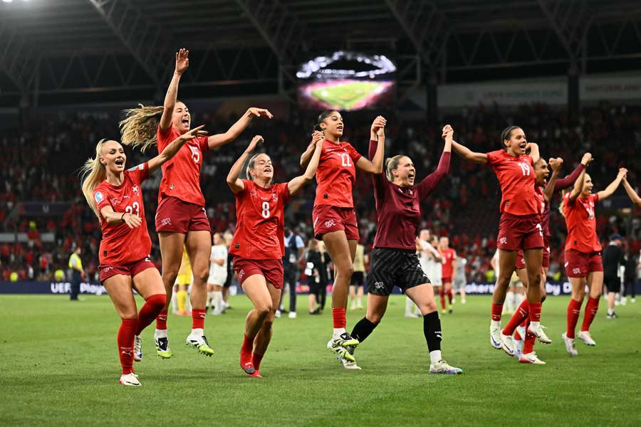 Switzerland's players celebrate after their Group A draw against Finland