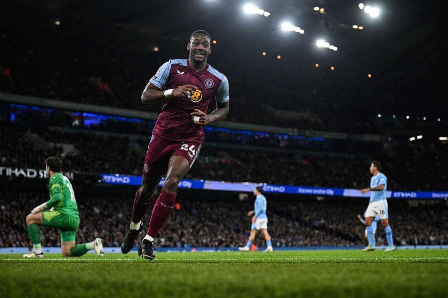 Aston Villa's Columbian striker #24 Jhon Duran (2nd L) celebrates after scoring