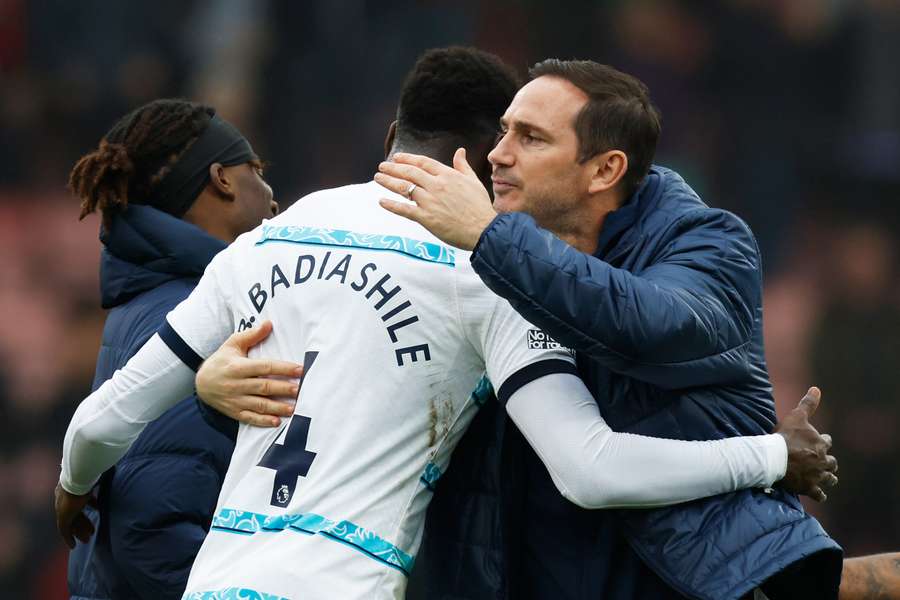 Chelsea's French defender Benoit Badiashile (C) celebrates with Chelsea's English interim manager Frank Lampard