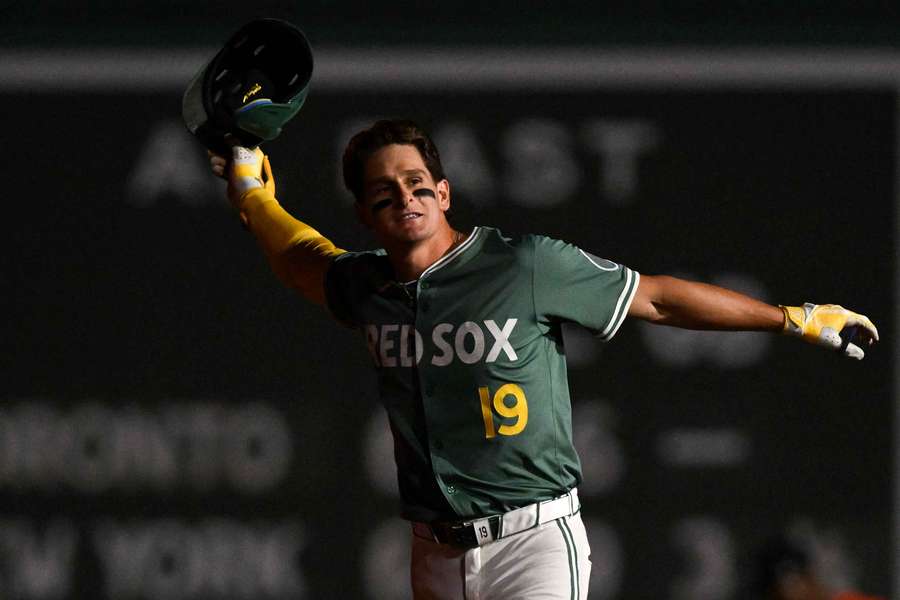 Roma Anthony about to toss his helmet in celebration after his walk-off hit on August 1, 2025