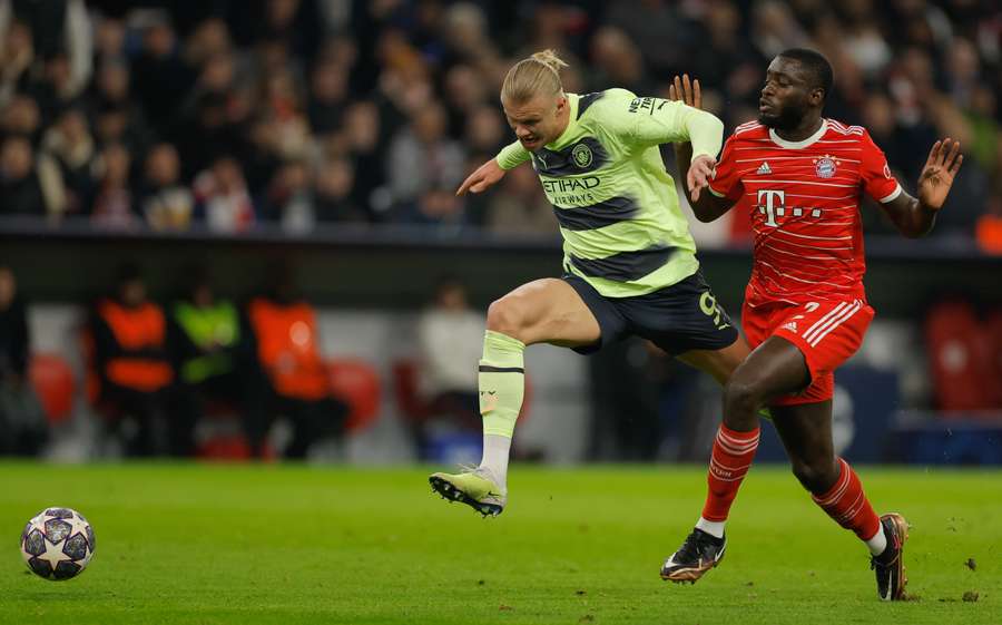 Dayot Upamecano brings down Erling Haaland but his red card is overturned by VAR Dayot Upamecano brings down Erling Haaland but his red card is overturned by VAR