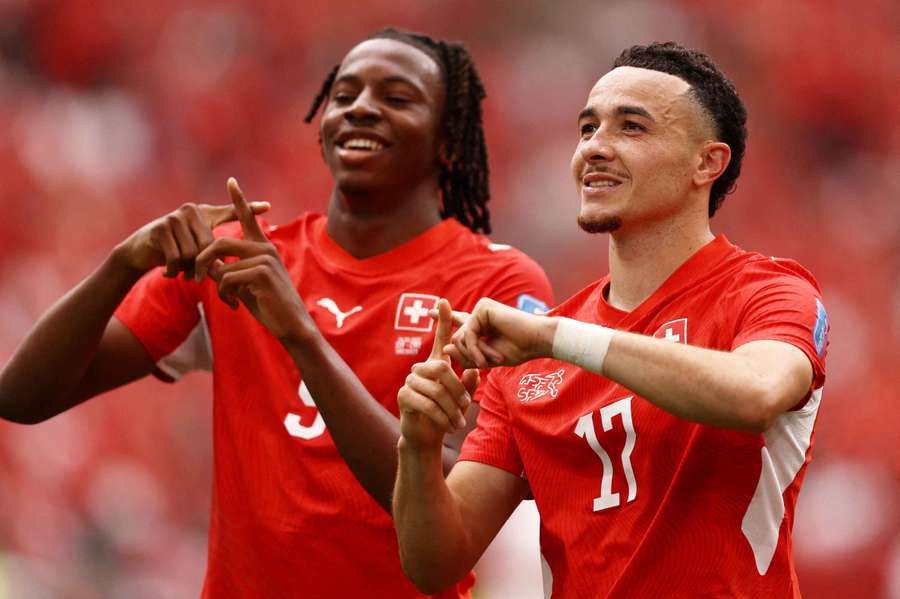 Switzerland's Ruben Vargas celebrates scoring their first goal with Johan Manzambi