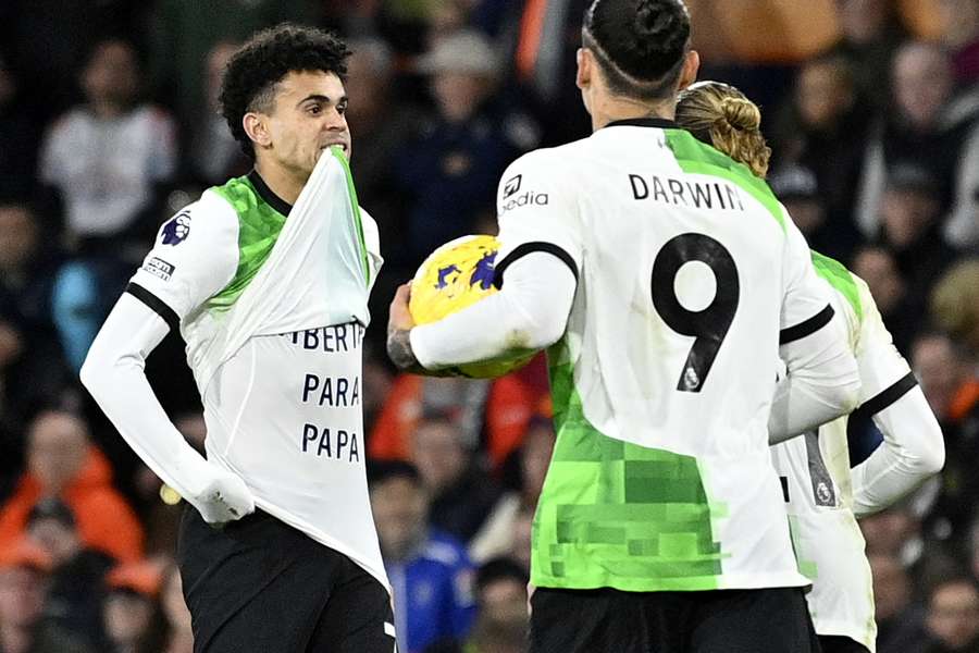 Liverpool's Luis Diaz celebrates scoring the equalising goal against Luton, unveiling a shirt that says 'Freedom for Papa'