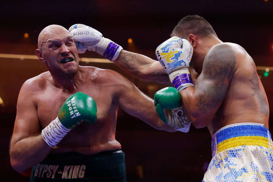 Oleksandr Usyk (right) became the first undisputed heavyweight champion in almost 25 years