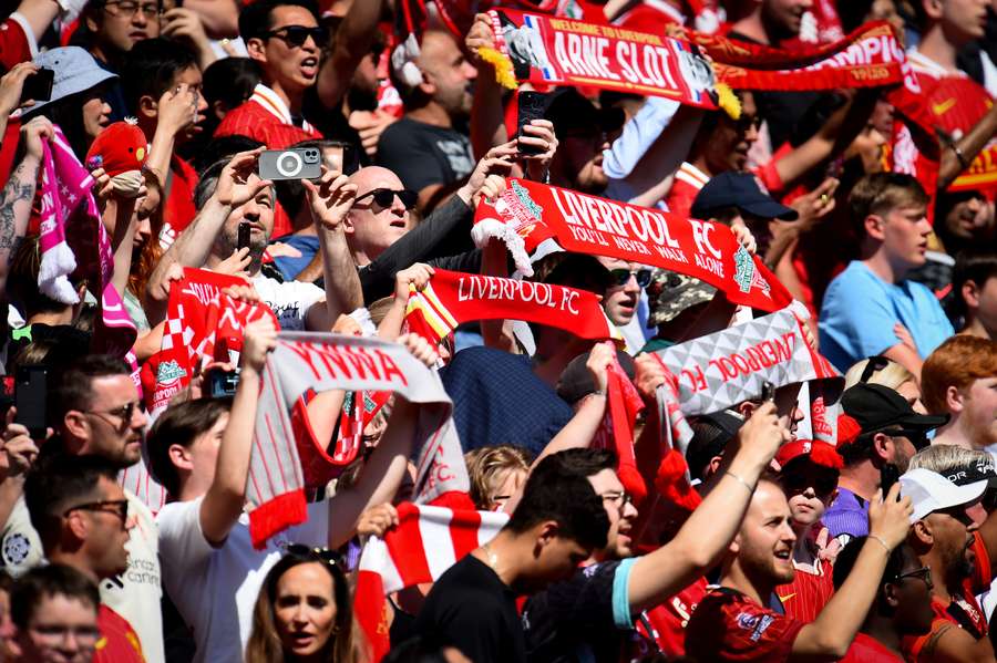 Liverpool fans hold scarves