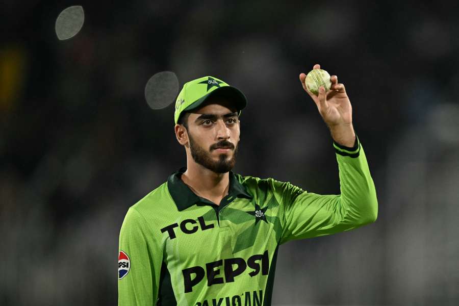 Arafat Minhas raises the match ball to acknowledge his debut five-for. Arafat Minhas raises the match ball to acknowledge his debut five-for.