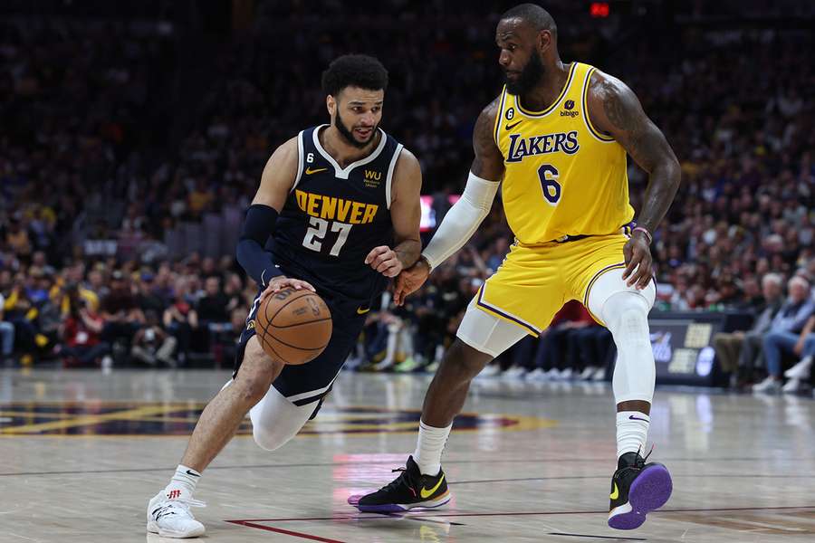 Denver's Jamal Murray drives against LeBron James of the Los Angeles Lakers