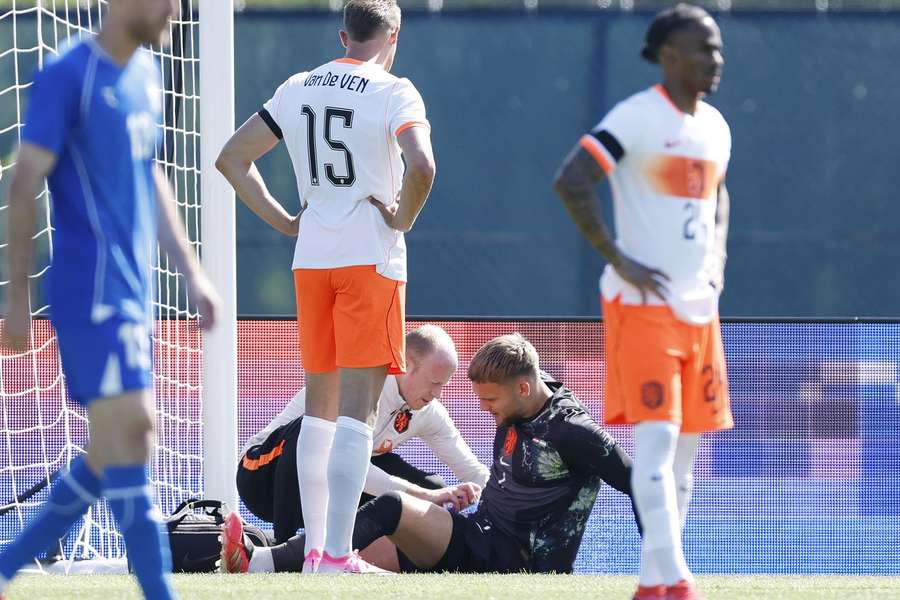 Bart Verbruggen receives treatment after taking landing awkwardly against Uzbekistan Bart Verbruggen receives treatment after taking landing awkwardly against Uzbekistan